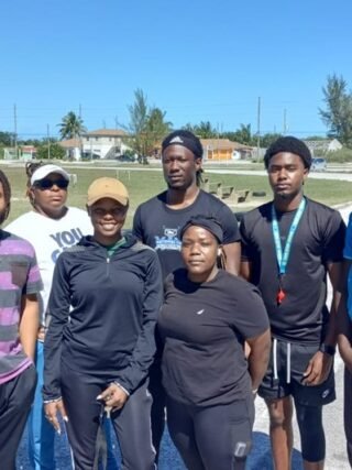 Dedicated participants of the Abaco D License Soccer Coaching Course stand alongside Technical Director Bruce Swan,